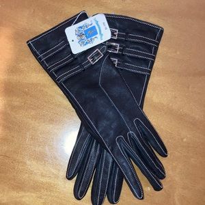 Woman’s long black leather gloves.